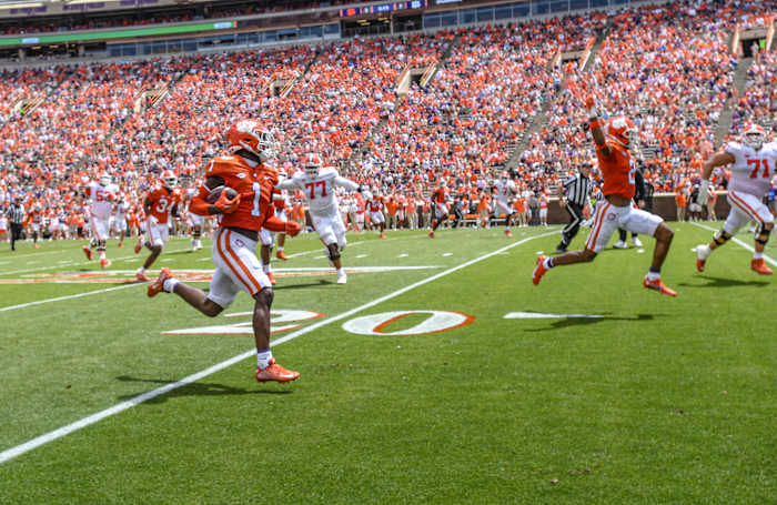 Clemson Tigers safety Andrew Mukuba runs with the ball.